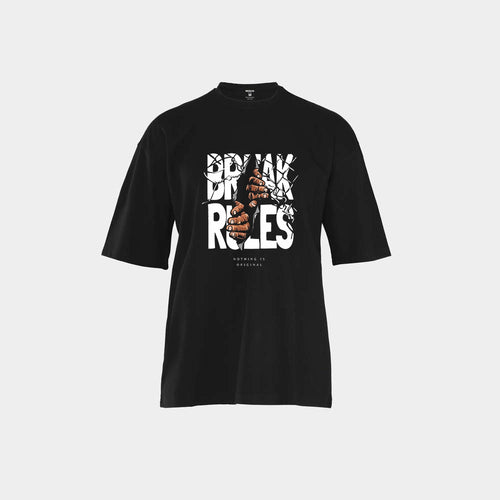 تيشيرت NOVUS BREAK RULES أسود أوفر سايز — يد تخرج من زجاج محطّم تمسك حروف BREAK RULES البيضاء